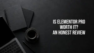 Desk workspace with laptop, notebook and coffee, titled Is Elementor Pro Worth It, An Honest Review